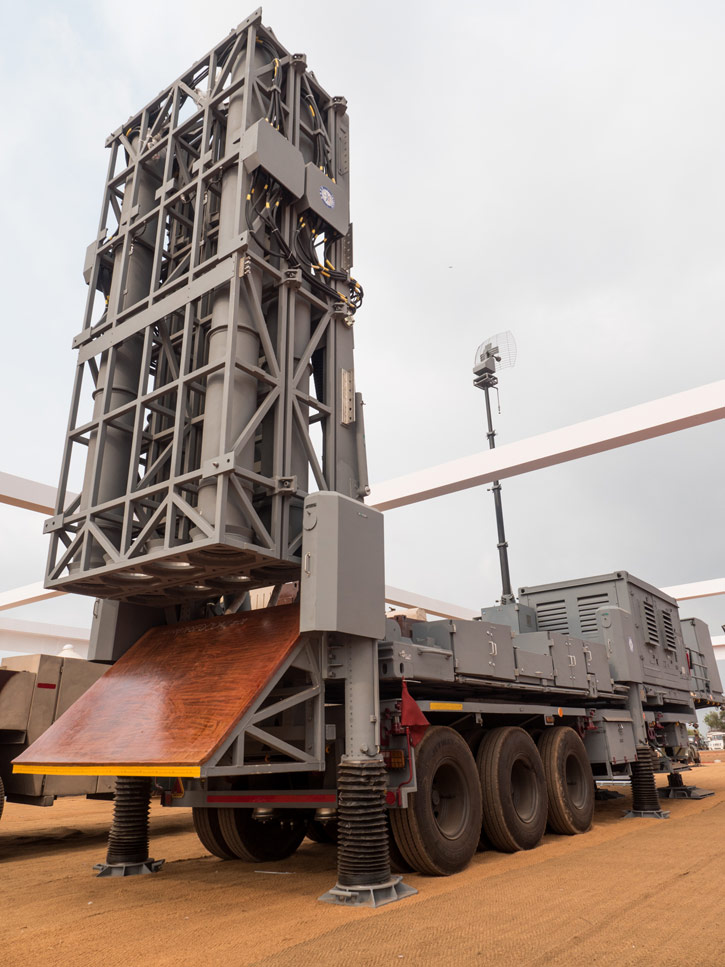 The MRSAM fire unit holds eight ready to launch missiles in two stacks. The missiles are fired vertically from their canister-launchers. To protect the fire unit assembly DRDO developed a unique thermally protected flame deflector that directs the rocket flames away from the trailer. This heat deflector can endure at least 60 launches, without damage. Photo: Noam Eshel, Defense-Update