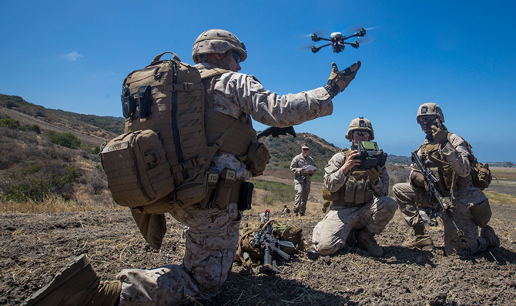 U.S. Marine Lance Cpl. Benjamin Cartwright, an infantry Marine with Kilo Company, 3rd Battalion 5th Marine Regiment, launches the Instant Eye MK-2 Gen 3 unmanned aerial system during an exercise for Marine Corps Warfighting Laboratory's Marine Air-Ground Task Force Integrated Experiment at Camp Pendleton, CA. (U.S. Marine Corps photo by Pfc. Rhita Daniel)