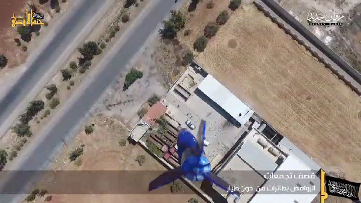 Syrian barracks under attack by bombs dropped from a quadcopter of an unknown type. 