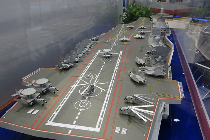 The rear deck of the future Project 23000E multi-purpose aircraft carrier shows a fleet of new air-superiority stealth fighters based on the T-50, MiG-29K multi-purpose strike fighters and a yet to be developed airborne early warning platform powered by two turboprop engines. Photo: Tamir Eshel, Defense-Update